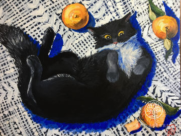 Black cat on a white tablecloth