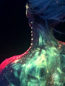 Space on the body. Working with neon paints