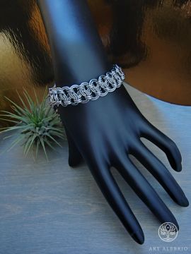 Steel chain mail bracelet with extending chain.