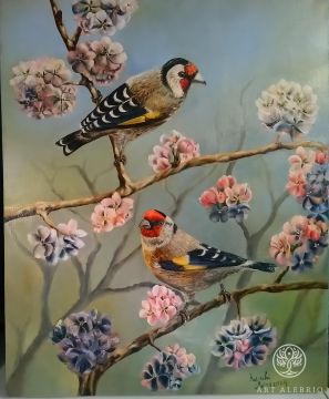 Goldfinches on a cherry blossom tree.